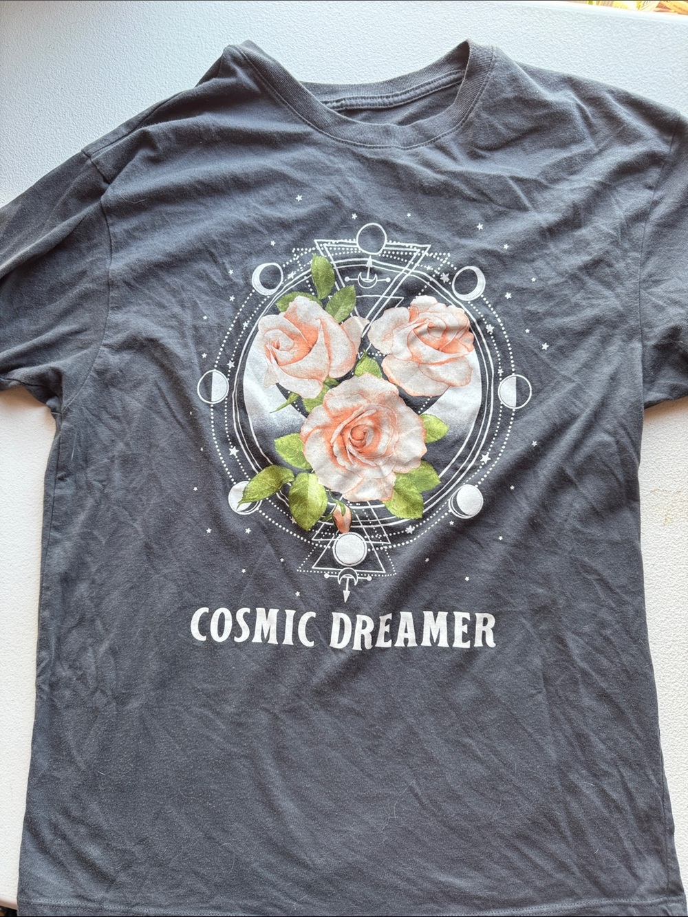 Cosmic Dreamer Black Tee with Peach Rose Graphic